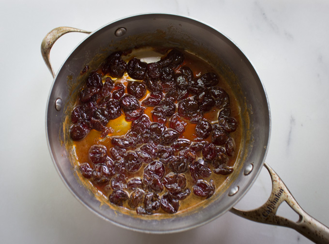 Overhead view of Cherry Jubilee Jam in a large silver pan